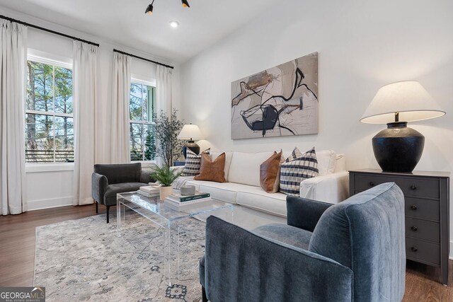 living room with recessed lighting, vaulted ceiling, and wood finished floors