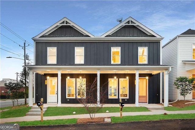 view of front of home with covered porch and board and batten siding