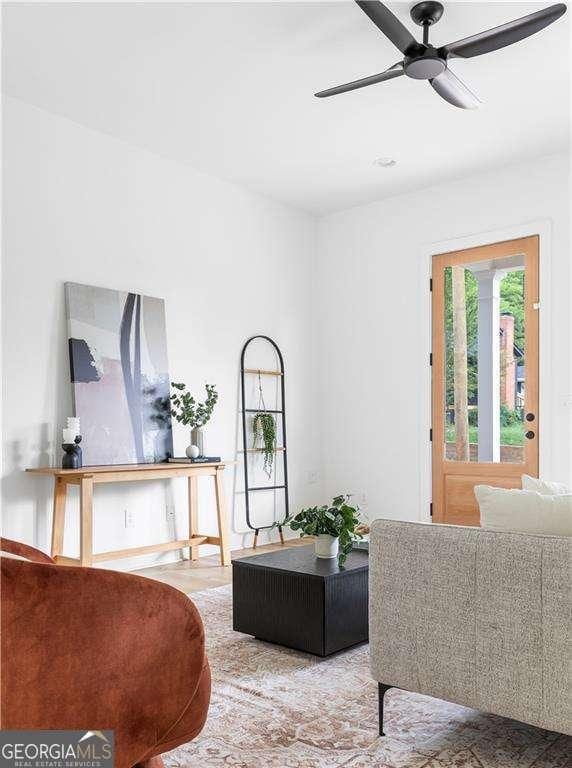 living area with a ceiling fan