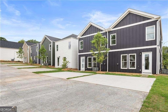 view of front of home featuring cooling unit and board and batten siding