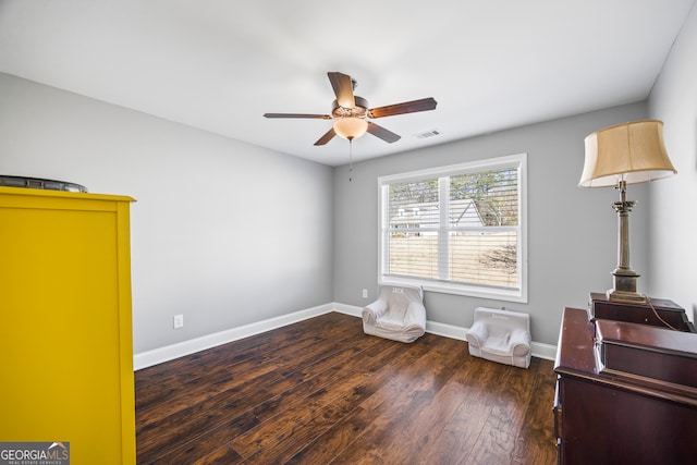 bedroom featuring visible vents, ceiling fan, baseboards, and wood finished floors