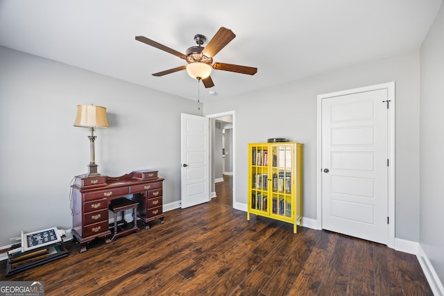 interior space featuring wood finished floors, a ceiling fan, and baseboards