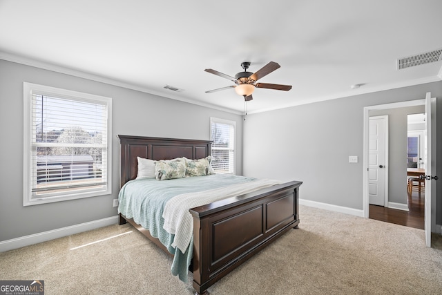 bedroom with carpet flooring, visible vents, and baseboards