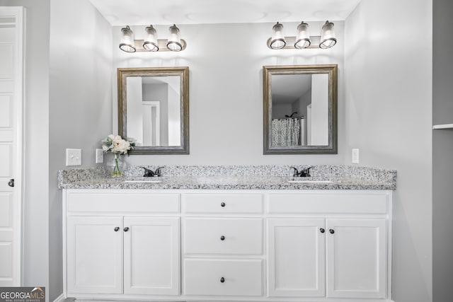 bathroom with double vanity and a sink