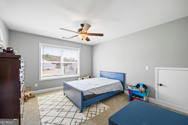 bedroom featuring a ceiling fan, light carpet, visible vents, and baseboards