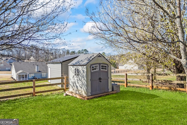 view of shed with fence