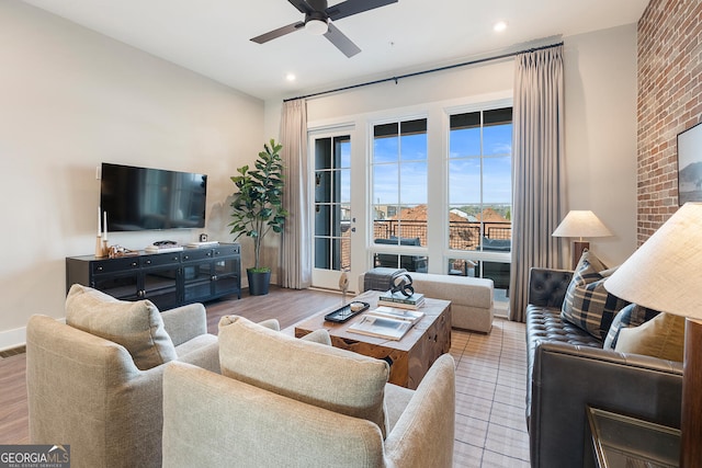 living room with ceiling fan, baseboards, visible vents, and recessed lighting