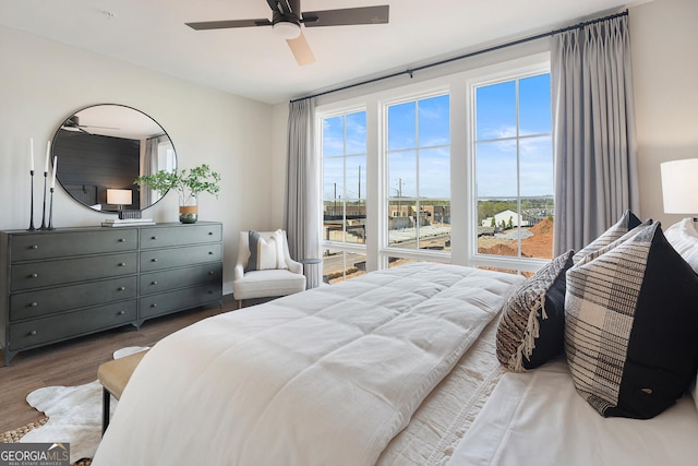 bedroom with ceiling fan and wood finished floors