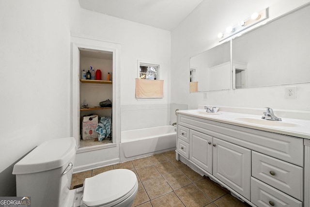 full bathroom featuring tile patterned floors, a sink, toilet, and double vanity