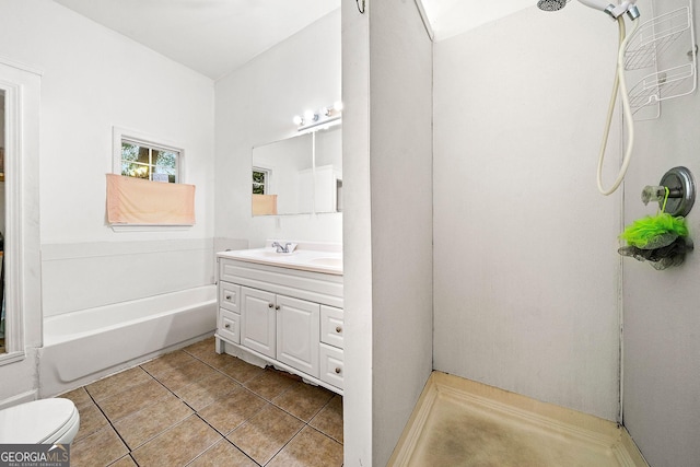 full bath featuring a tub to relax in, tile patterned flooring, toilet, vanity, and walk in shower