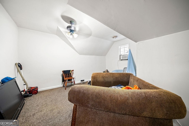 sitting room with vaulted ceiling, carpet floors, a ceiling fan, and baseboards