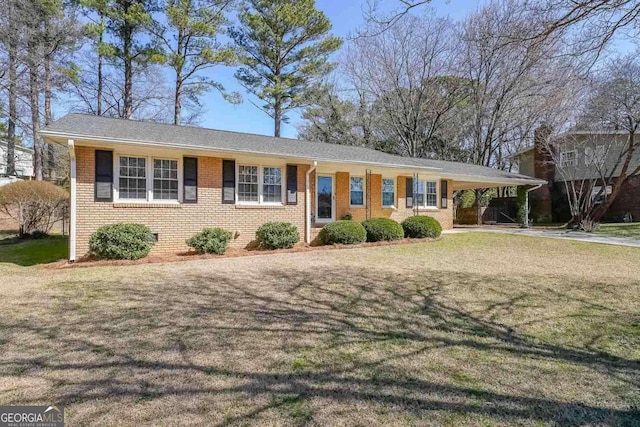 ranch-style house with crawl space, a front lawn, an attached carport, and brick siding