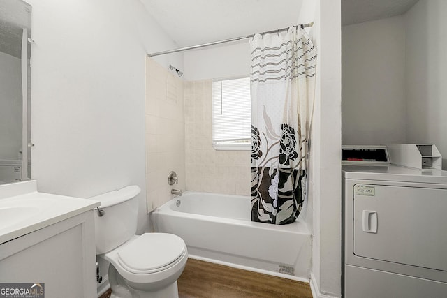 bathroom with shower / bath combination with curtain, washer / clothes dryer, toilet, vanity, and wood finished floors