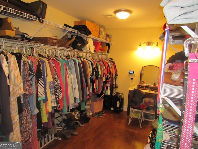 spacious closet with wood finished floors