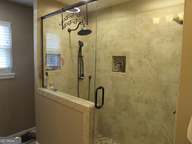 bathroom with a shower stall