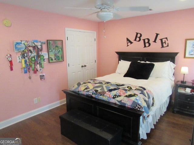 bedroom featuring a ceiling fan, baseboards, and wood finished floors