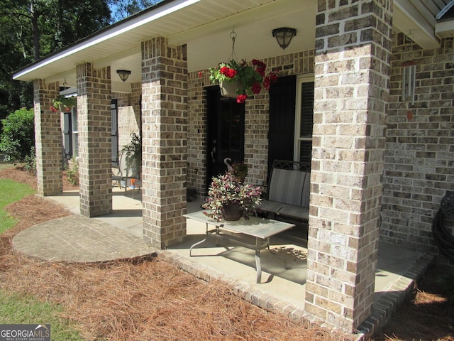 entrance to property with brick siding