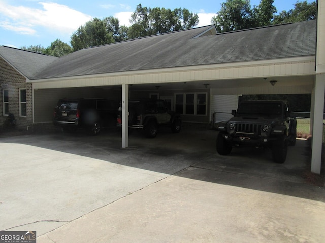 exterior space with an attached carport and driveway