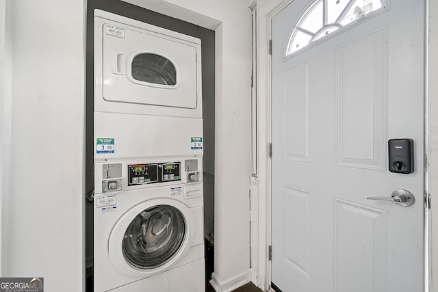 laundry room with stacked washer and dryer