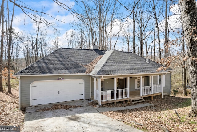 ranch-style house with a garage, covered porch, roof with shingles, and driveway