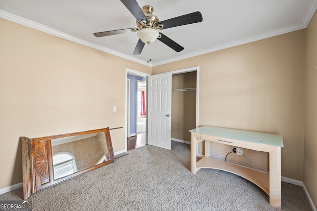 unfurnished bedroom featuring ornamental molding, a closet, carpet flooring, and baseboards