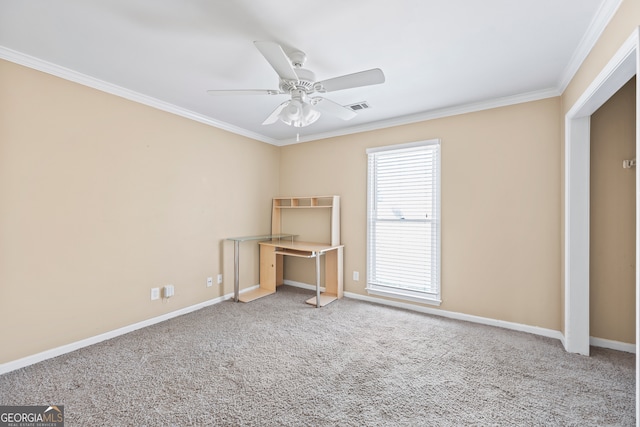 interior space with carpet floors, visible vents, a ceiling fan, and ornamental molding