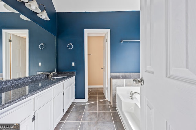 bathroom featuring a bath, vanity, and tile patterned floors