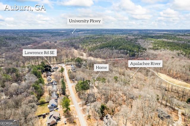 drone / aerial view with a view of trees