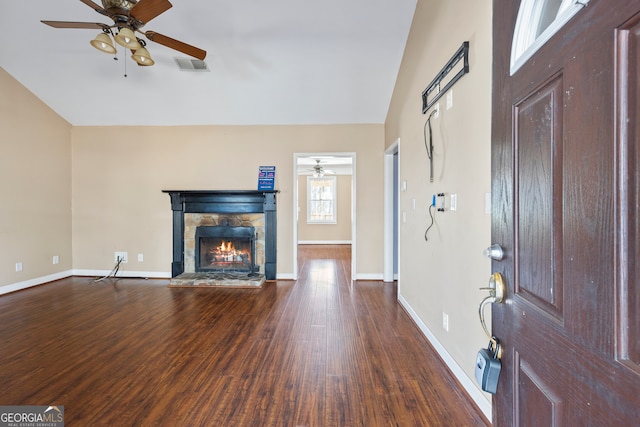 unfurnished living room featuring a ceiling fan, dark wood-style flooring, visible vents, and a fireplace