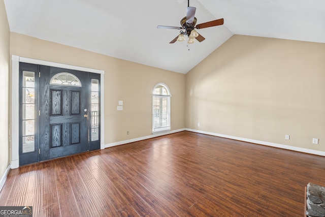 foyer entrance featuring vaulted ceiling, ceiling fan, wood finished floors, and baseboards