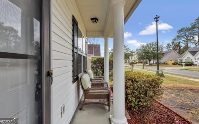 view of patio featuring a porch