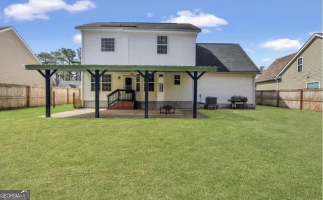 back of house featuring a patio, a yard, a fenced backyard, and central air condition unit