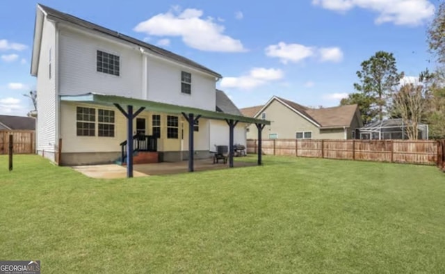 back of house with a patio area, a fenced backyard, and a yard