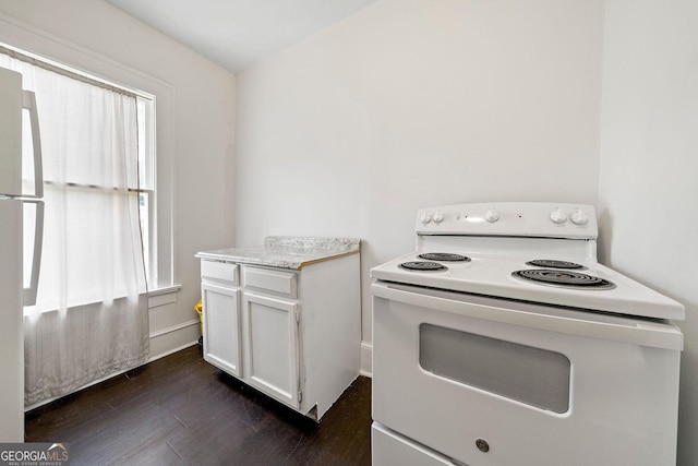 kitchen with white appliances, dark wood-type flooring, white cabinetry, baseboards, and light countertops