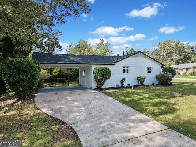 single story home with driveway, crawl space, a front yard, a carport, and brick siding