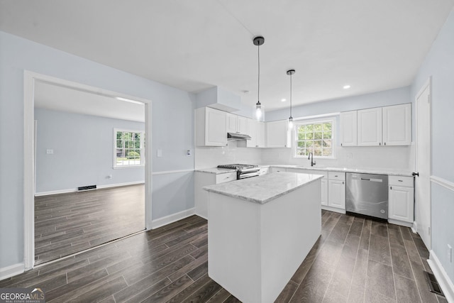 kitchen featuring visible vents, white cabinetry, appliances with stainless steel finishes, decorative backsplash, and dark wood finished floors