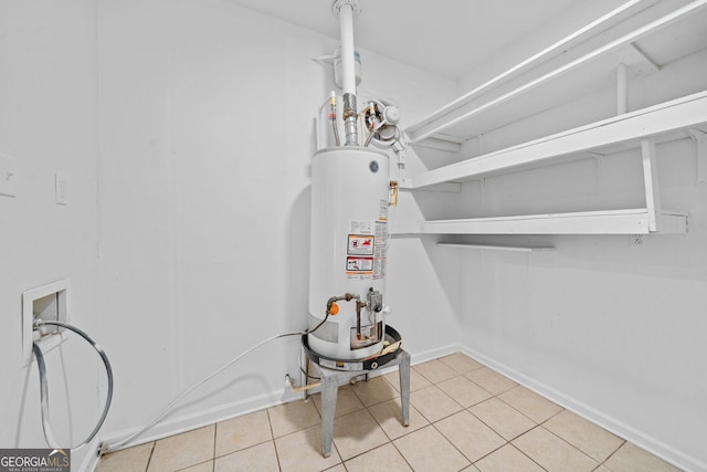 interior space featuring water heater and baseboards