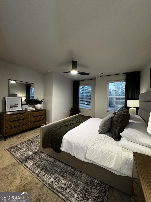 carpeted bedroom featuring a ceiling fan