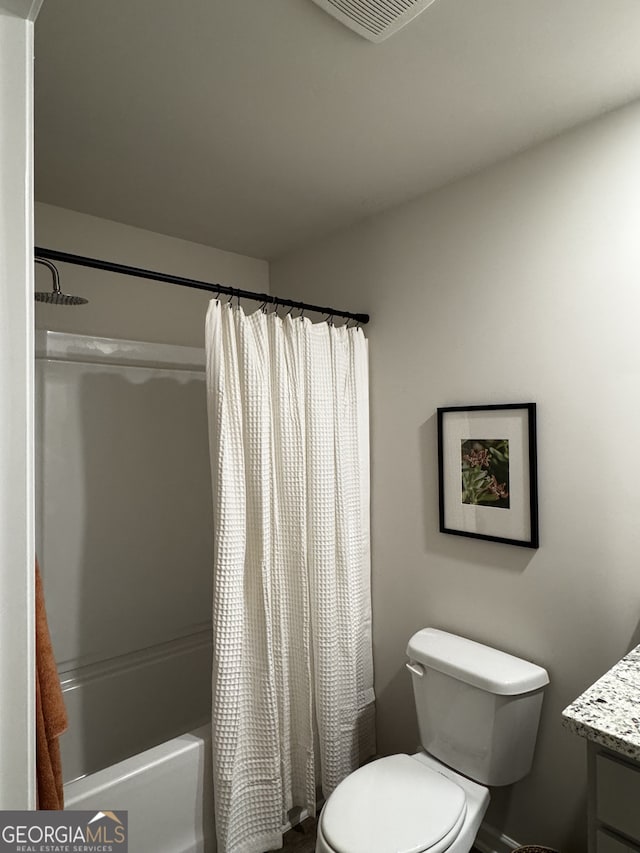 full bathroom with toilet, visible vents, shower / tub combo with curtain, and vanity