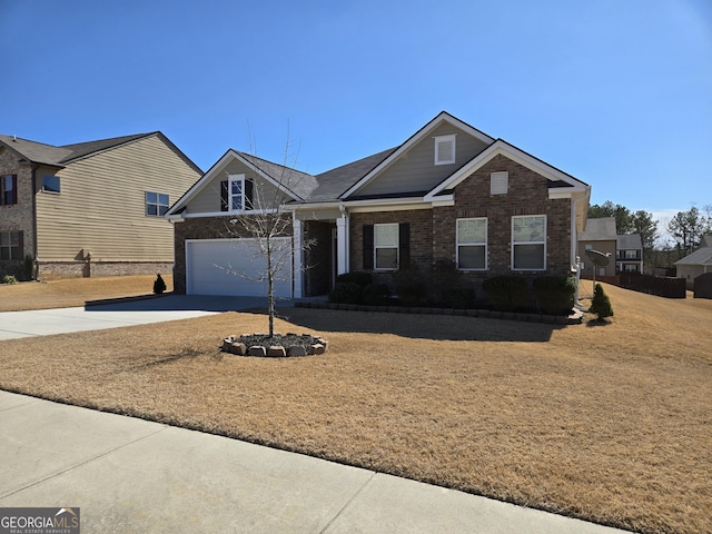 view of front facade with a garage, brick siding, and concrete driveway