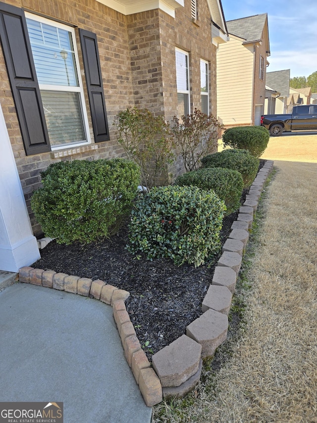 view of property exterior with brick siding