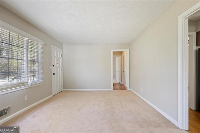 5812 Dogwood Cir, Austell, GA 30168 - carpeted spare room with a textured ceiling and baseboards