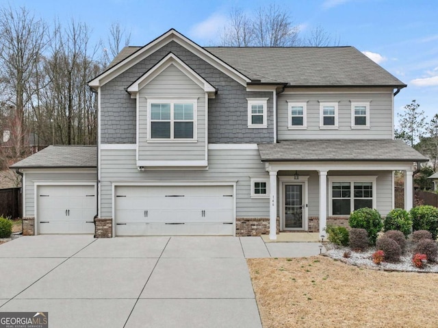 craftsman-style home with driveway and an attached garage