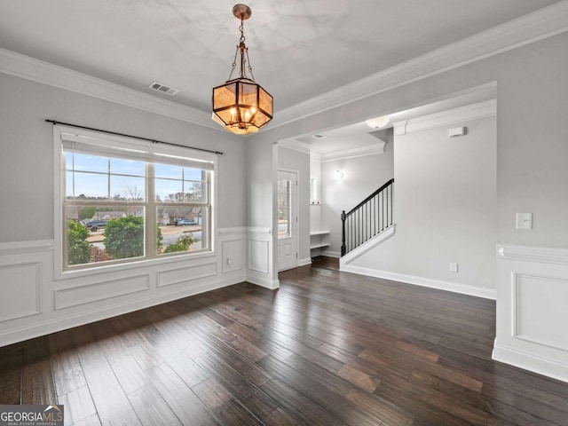 interior space featuring dark wood-type flooring, visible vents, crown molding, and stairway