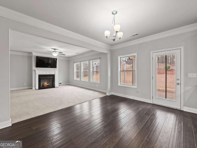 unfurnished living room featuring crown molding, visible vents, a fireplace with flush hearth, baseboards, and hardwood / wood-style flooring