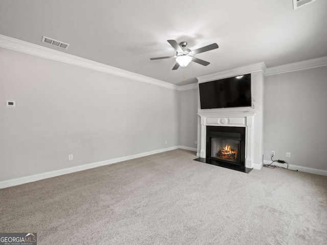 unfurnished living room featuring ornamental molding, a fireplace with flush hearth, visible vents, and baseboards