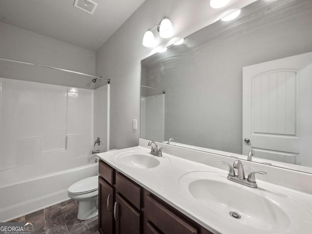 full bath featuring visible vents, a sink, toilet, and double vanity