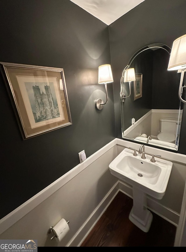 204 E Liberty St, Savannah, GA 31401 - half bath with a sink and wood finished floors