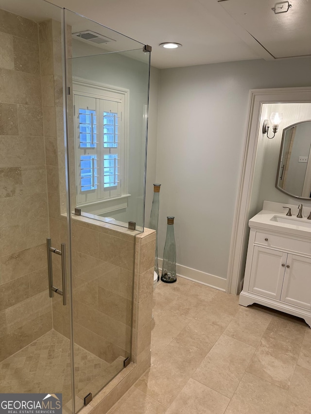 bathroom with recessed lighting, visible vents, a stall shower, vanity, and baseboards