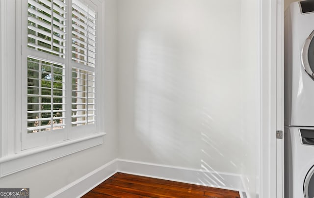204 E Liberty St, Savannah, GA 31401 - washroom with stacked washer and clothes dryer, baseboards, and dark wood-style flooring